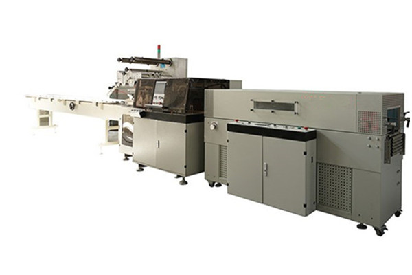 Reciprocating shrink film packaging machine